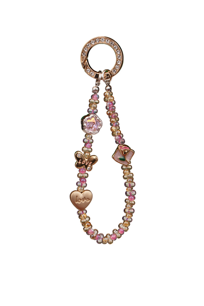 Soft Love phone charm attached to phone with included tether tab