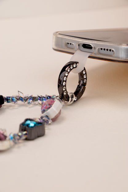 Phone tether tab attached to Blue Ribbon phone charm on phone case