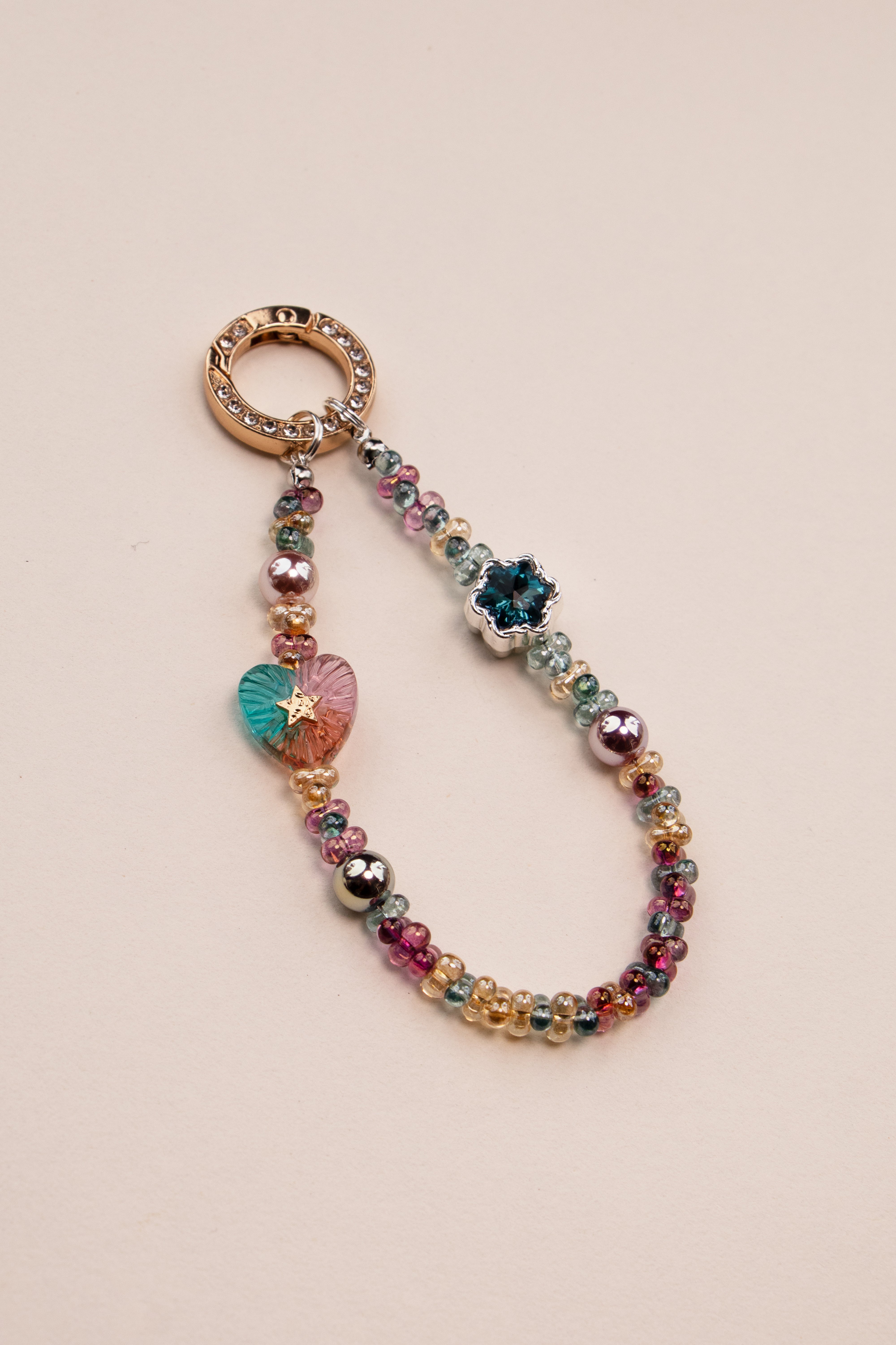 Daydream Heart beaded phone charm attached to phone with tether tab