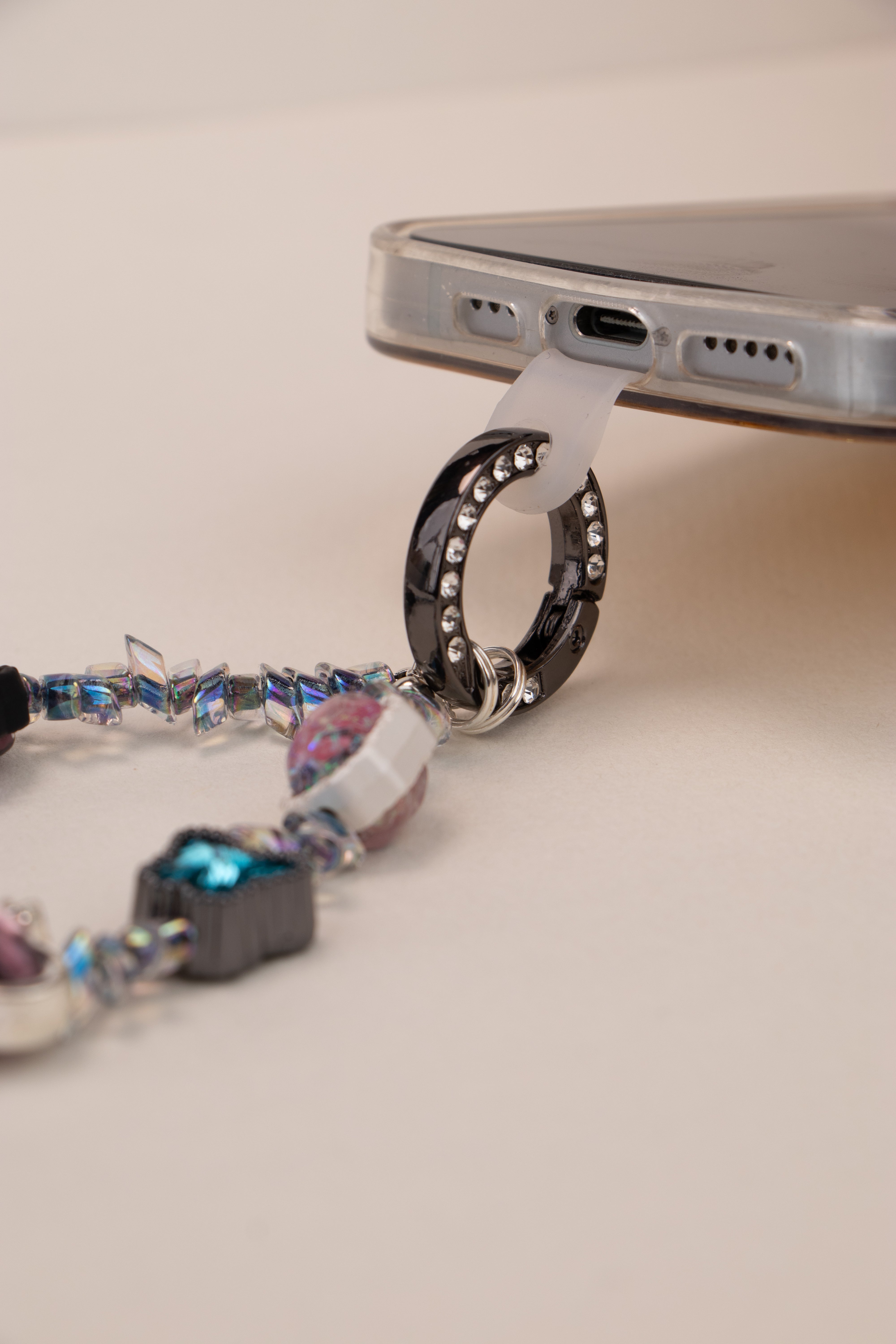 Midnight Flutter beaded phone charm with teal butterfly and purple heart details