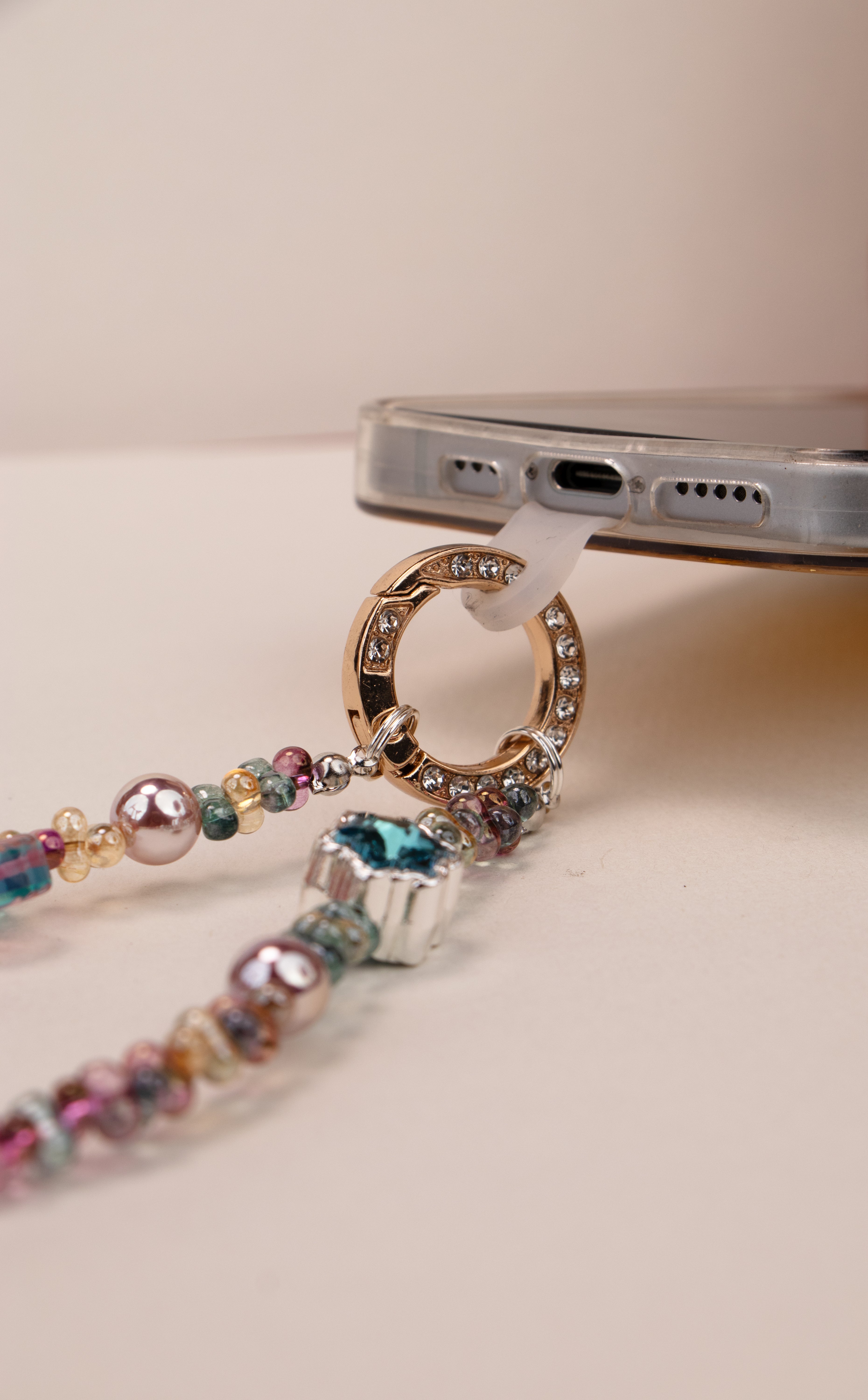 Little Luck beaded phone charm with star bow and warm charm details