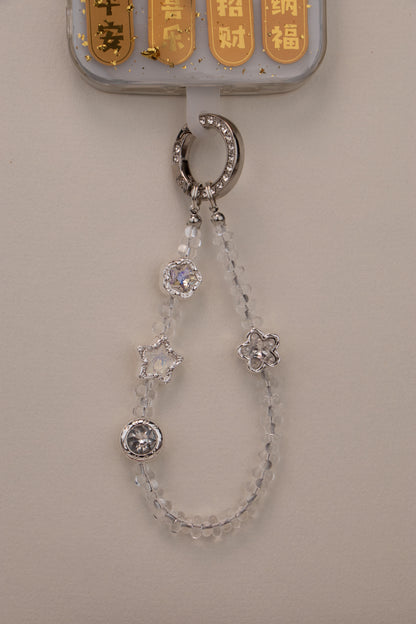 Quiet Star phone charm attached to phone with included tether tab